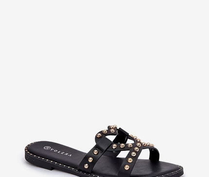 Sandales noires inspirées du Brésil avec détails métalliques dorés, design audacieux et élégant rappelant l'esprit festif des plages brésiliennes, idéales pour l'été.