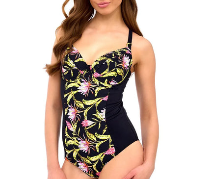 Maillot de bain une-pièce pour femme avec imprimé tropical inspiré des paysages et de la flore du Brésil, combinant élégance et confort avec des motifs colorés représentant des fleurs exotiques sur un fond noir, parfait pour une allure chic et joyeuse.