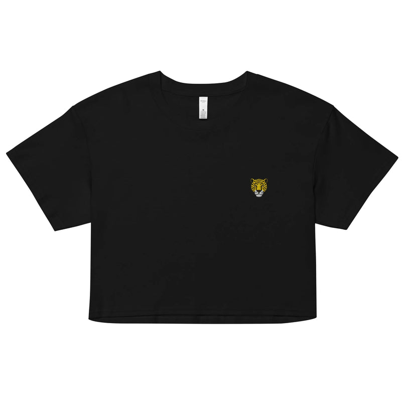 Haut noir à manches courtes pour femmes avec un design minimaliste, arbore un motif de tête de jaguar jaune et noir, symbole de la forêt amazonienne. Inspiration urbaine des grandes villes brésiliennes comme São Paulo et Rio de Janeiro. Style décontracté et sophistiqué, mettant en valeur la culture et la richesse naturelle du Brésil.