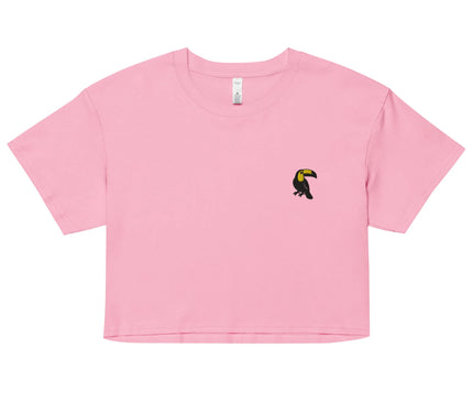 T-shirt rose court avec un motif minimaliste représentant un toucan noir et jaune, symbole de la biodiversité brésilienne, incarnant l'essence tropicale et décontractée du Brésil. Idéal pour un style moderne évoquant la culture et la nature de l'Amazonie.