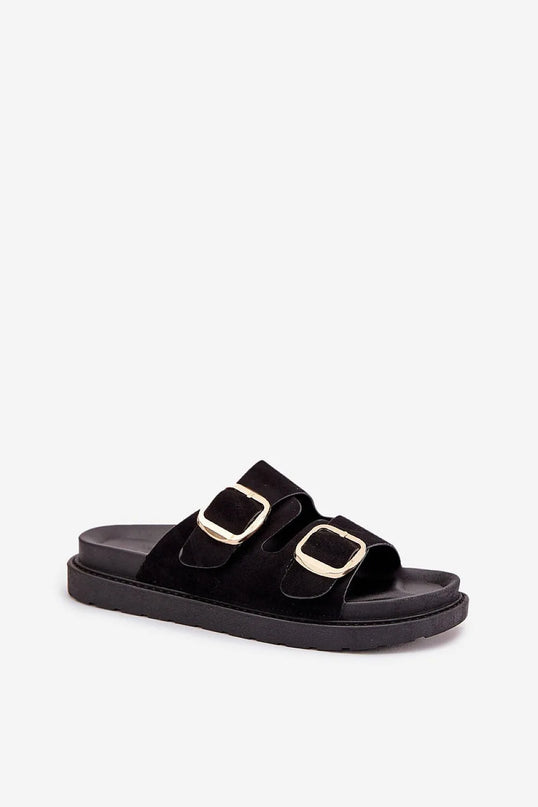 Sandales noires inspirées du Brésil avec larges brides et boucles dorées, reflétant un style chic et décontracté, parfaites pour le confort et l'élégance au quotidien.